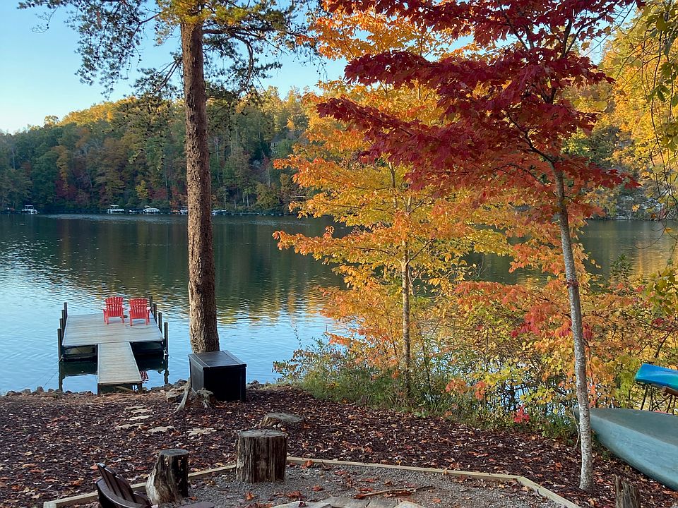 Lake area with private dock, fire pit, hammock, canoe and kayaks.