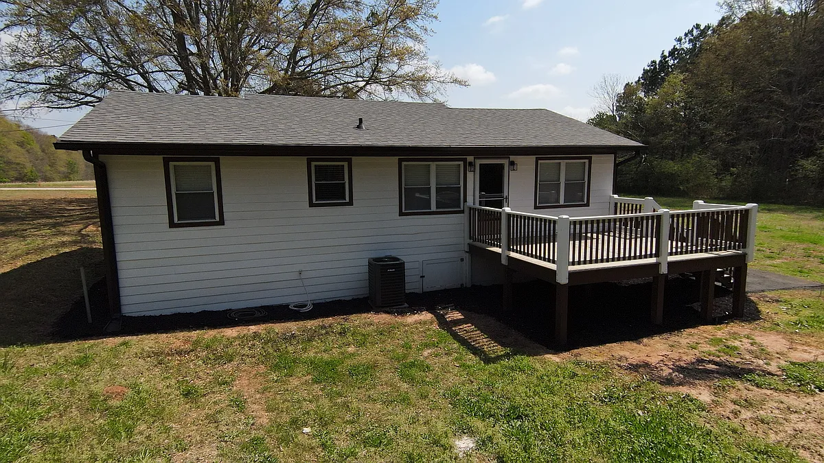 12' x 15'' rear deck that overlooks a spacious backyard. - 970 Jim Daws Rd