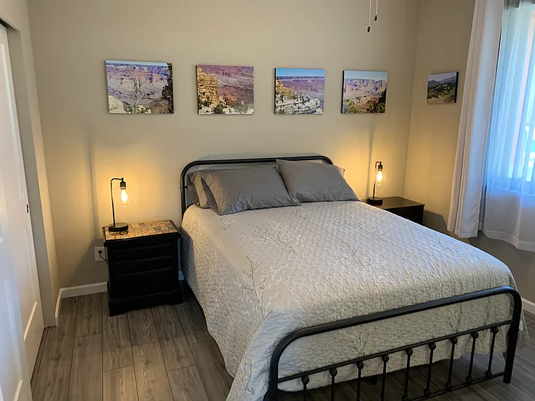 The Grand Canyon Room, so named because of the artwork, furnished with a Queen size bed, lightly used, but high quality mattress, desk and chair