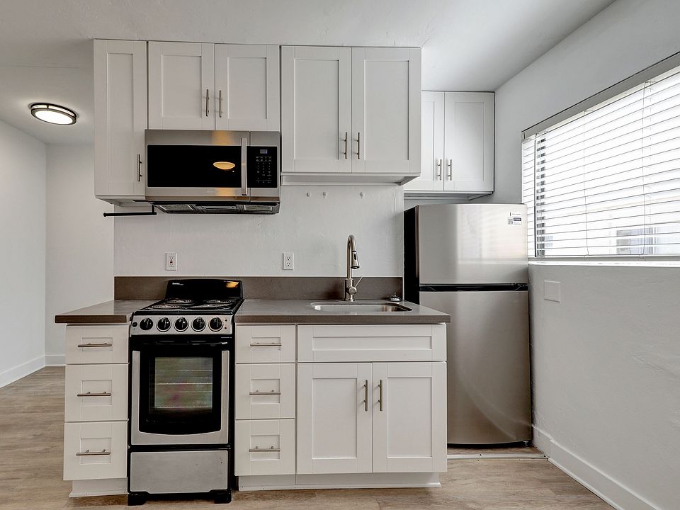 Kitchen boasts modern touches with stainless steal appliances and quartz counter tops