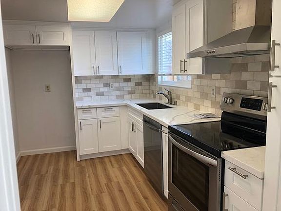 Newly remodeled kitchen with new appliances (tenant provides own refrigerator).