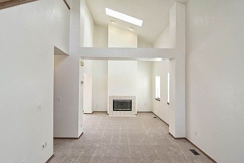 Dramatic 2-story vaulted Living Room