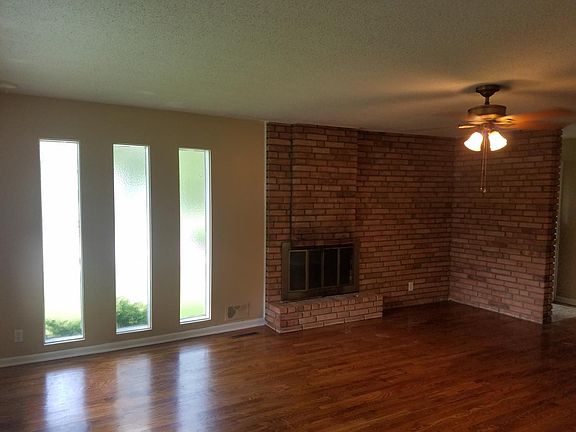 FLOOR to CEILING CUSTOM BRICK FIREPLACE converted to electric for EZ cleaning no more ashes