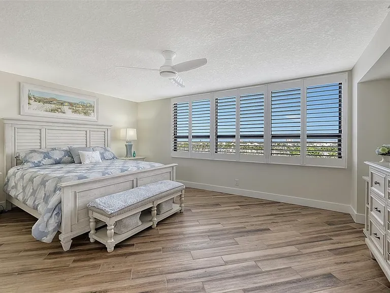Large Primary suite, plantation shudders, water views, large flatscreen TV, beautifully remodeled attached bathroom and closet.