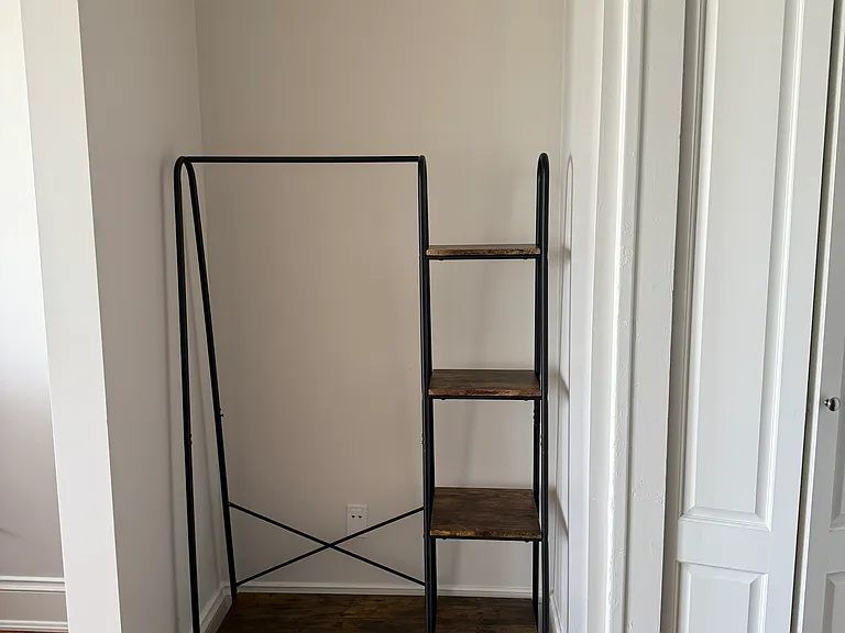 A spot to put your purse, backpack, hang a hoodie, put your shoes, etc. Laundry closet is to the right.