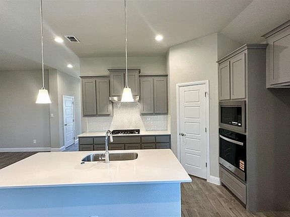 Kitchen-All Home and community information, including pricing, included features, terms, availability and amenities, are subject to change at any time without notice or obligation. All Drawings, pictures, photographs, video, square footages, floor plans, elevations, features, colors and sizes are approximate for illustration purposes only and will vary from the homes as built.