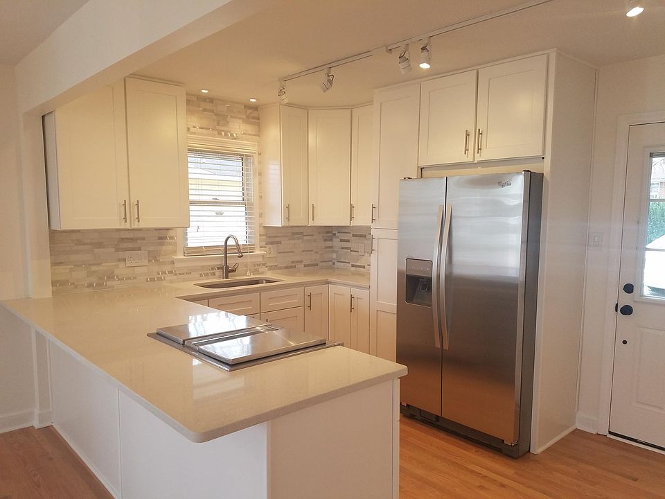 Kitchen looking out back door, parking in back