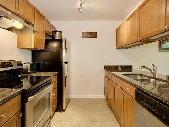 Galley kitchen has granite counters, SS appliances & good cabinet space. Washer & dryer included.