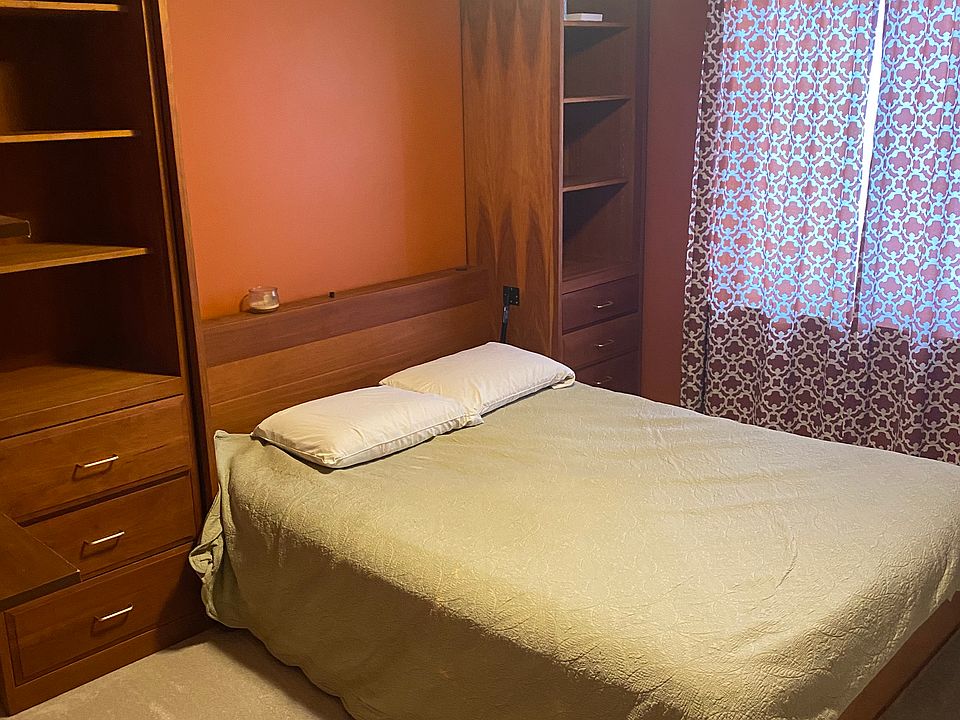 Murphy bed can go up and down in one room or be removed. built in shelves.