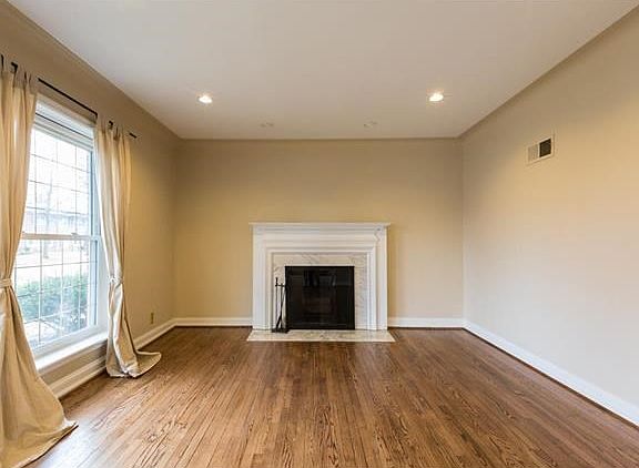 Warm and inviting Living room. Large windows offer a picture view of Cornell Avenue.