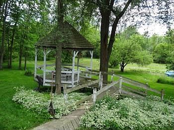 Decking leads to a gazebo plus the 4.9 acres of land to the Chippewa River.