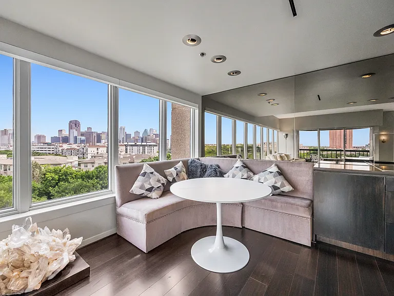 Panoramic windows bring the skyline into the open-concept living and kitchen areas.