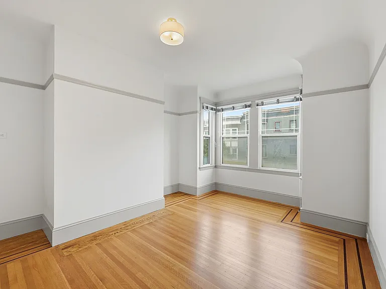 Large & bright 1st bedroom with view to the front of the unit