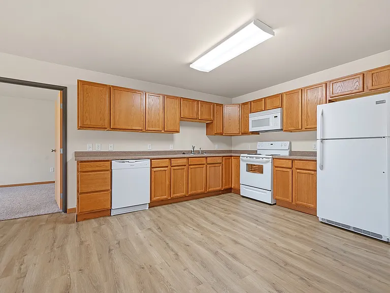 Step into modern living with the inviting kitchen at Paramount at the Bluffs Apartments. Featuring ample cabinetry and contemporary appliances, this space is perfect for culinary creativity. Find your ideal home today!