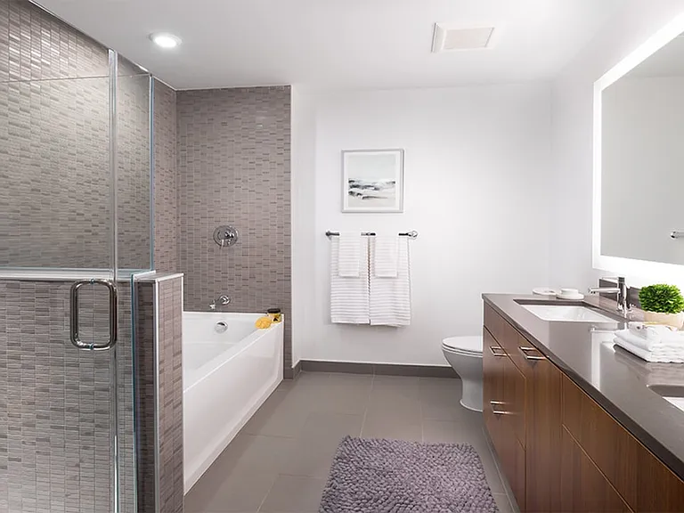 Serene bathrooms with spa-like soaking tubs, glass showers with subway tile surrounds