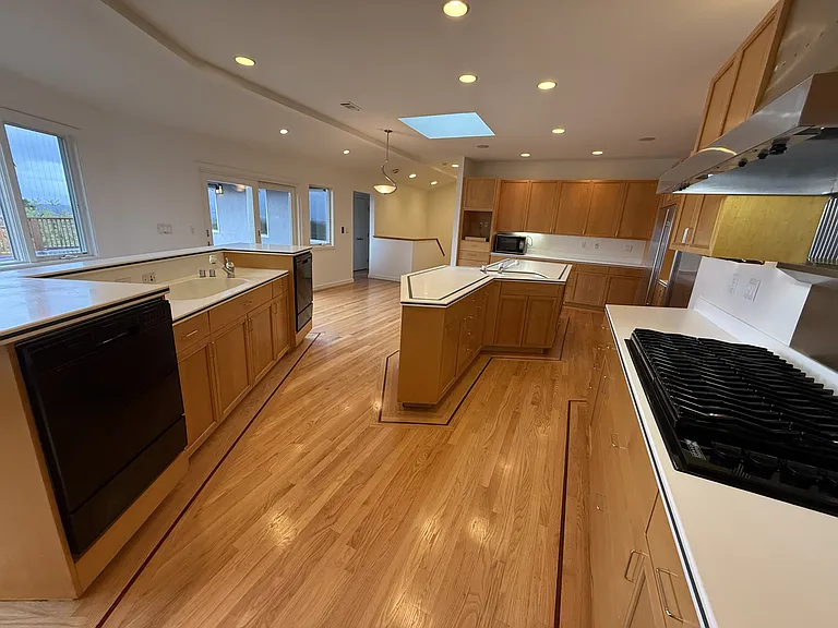 Chef's dream gourmet kitchen features two islands, freezer, refrigerator, two dishwashers, a pot-filler faucet and stainless-steel appliances.