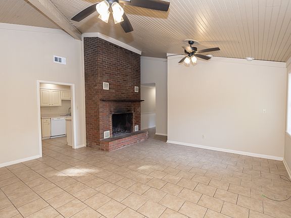Living room with look into kitchen.