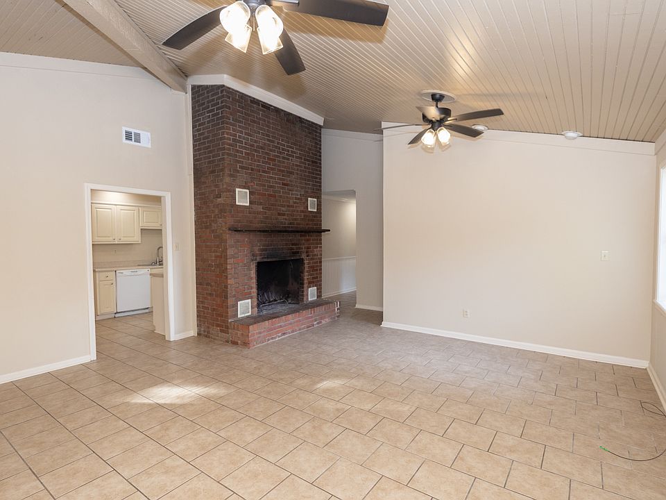 Living room with look into kitchen.