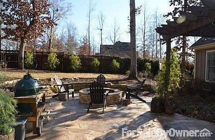 Large Beautifully Stained-Fence Backyard
						:
						Features stone patio, large fire pit, covered pergola.