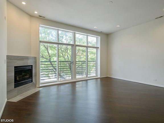 HUGE living room with gas fireplace and juliet balcony! Enjoy fresh air and the fall breeze- these sliding doors fully open & have screens! Pets? They will love this!