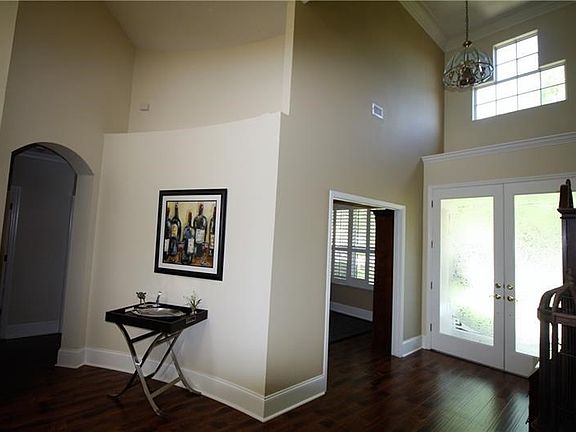 Entrance Features Etched Glass Doors & Soaring Ceiling