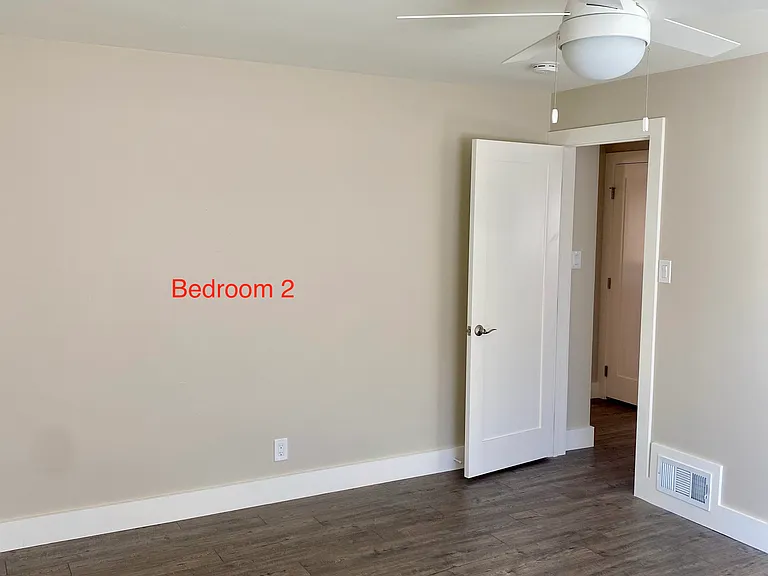 Bedroom 2- one window on the south side, closet and entry to basement.