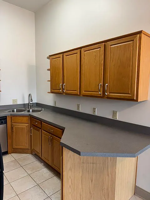 Large kitchen with lots of cabinets.