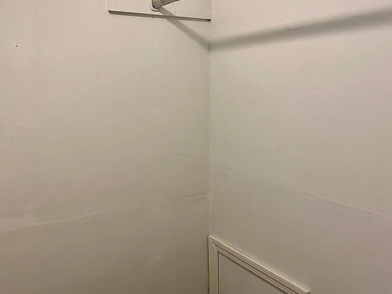 Sizeable walk-in closet and storage area between bedroom and bathroom.