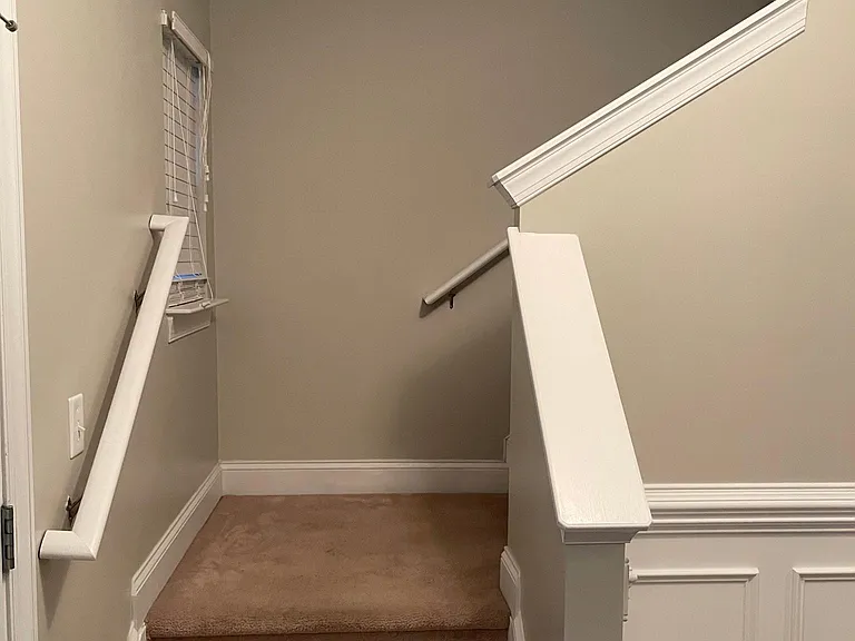 Stairs to left of front door