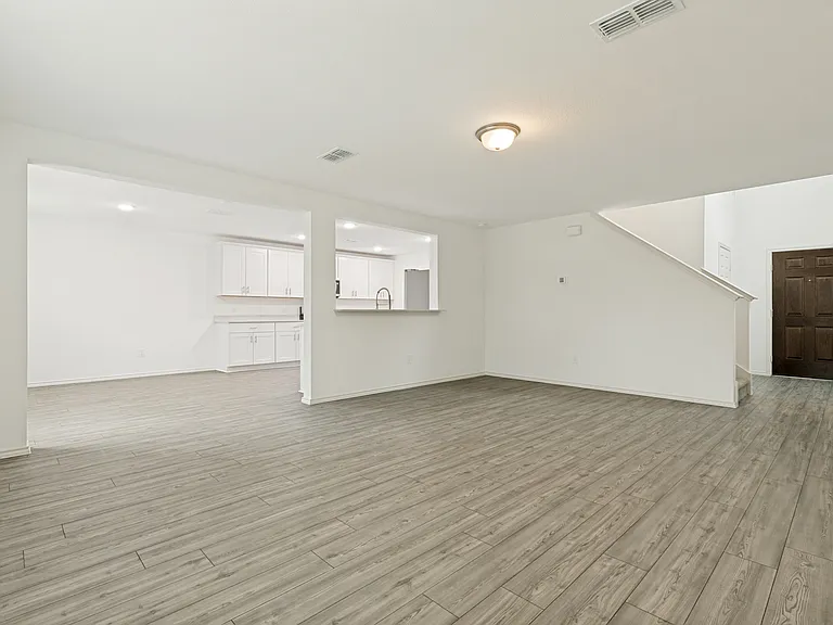 Living room opens to kitchen and dining