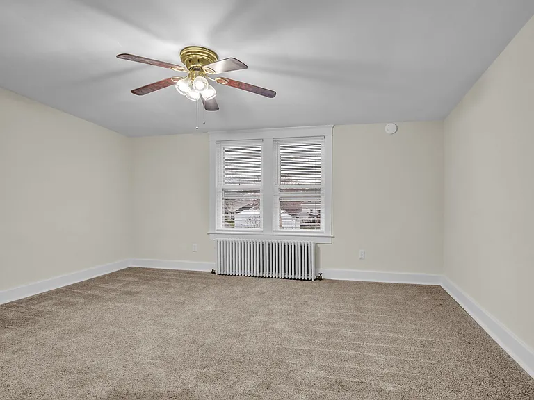 Bedroom 1 15.5'x14.5' in the rear with windows to the backyard