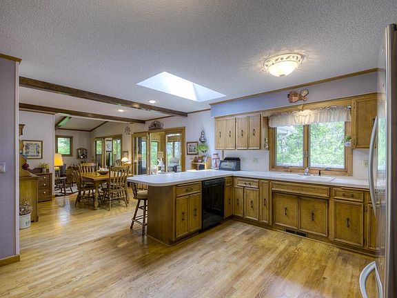 View of kitchen dining room and porch.  This view is from the door leading to the garage.