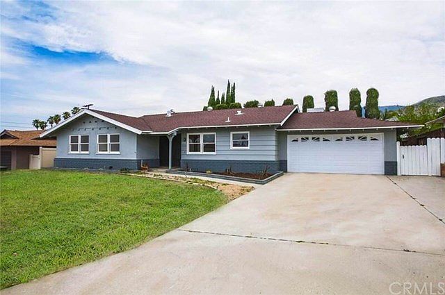 Lovely single-story home is freshly painted inside and out (lawn grass is Photoshopped)
