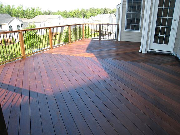 Wow! Ipe Deck overlooks back yard,  Stamped Patio underneath.