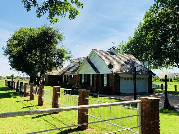 Front yard with mature oaks