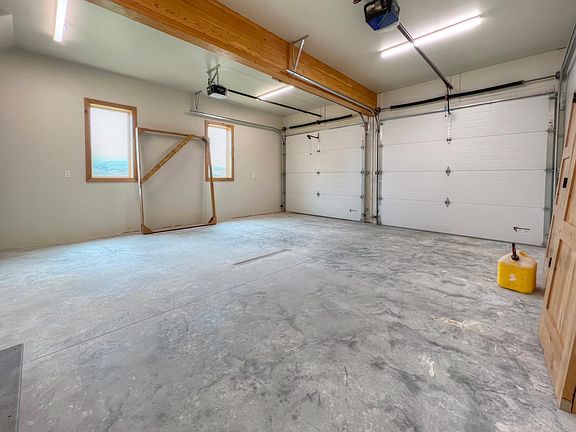 Large 2-car garage with central drain