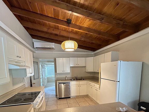 Kitchen. Beautiful cypress vaulted ceiling.