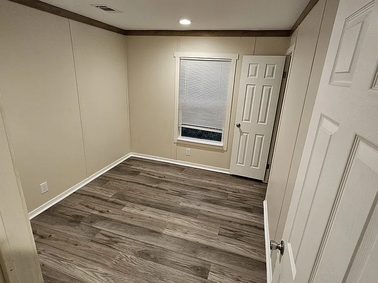 Bedroom #1 with its own closet as well in the corner.