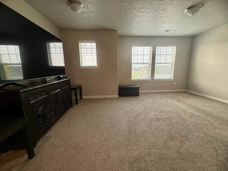 Wider view of upstairs super loft -ideal for a media room, playroom, or extra living space. Room size about 12'1"x 17'8".