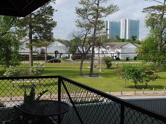 The balcony is large enough for a table and chairs.