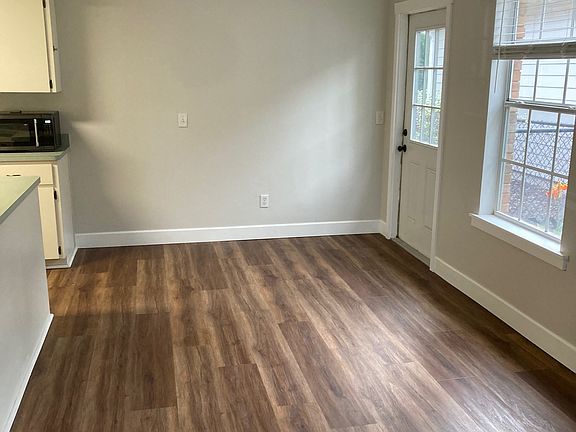 Dining area viewed from living room. Kitchen is to the left of dining area.