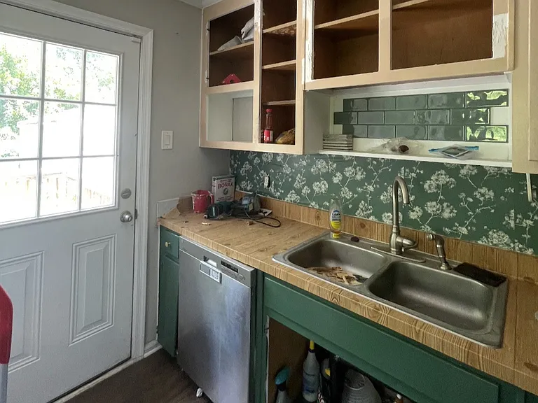 fenced backyard exit from kitchen