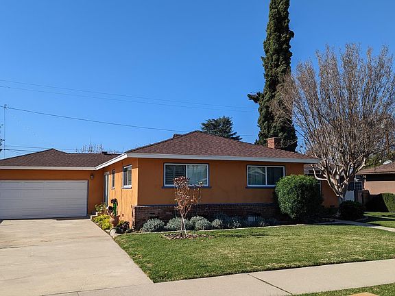 Attached 2-car garage and wide driveway.