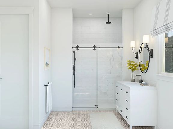 Primary bath with glass shower enclosure