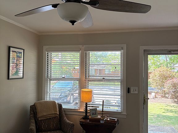 A perfect reading or working corner with natural light. Both front door and back door off glass doors to brighten up the space.