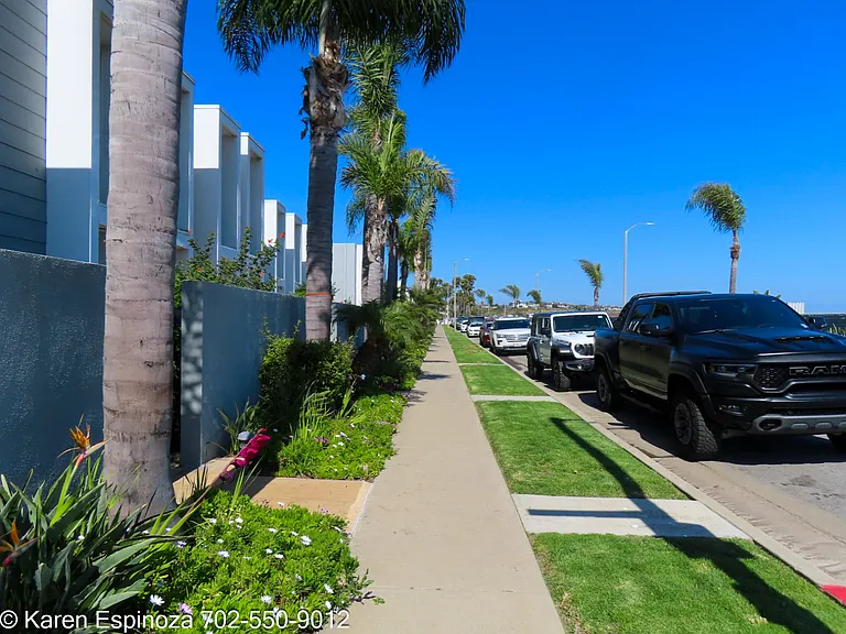 Front of condo with parking on the street
