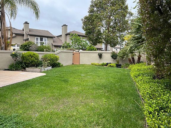 The backyard with access to common area via gate