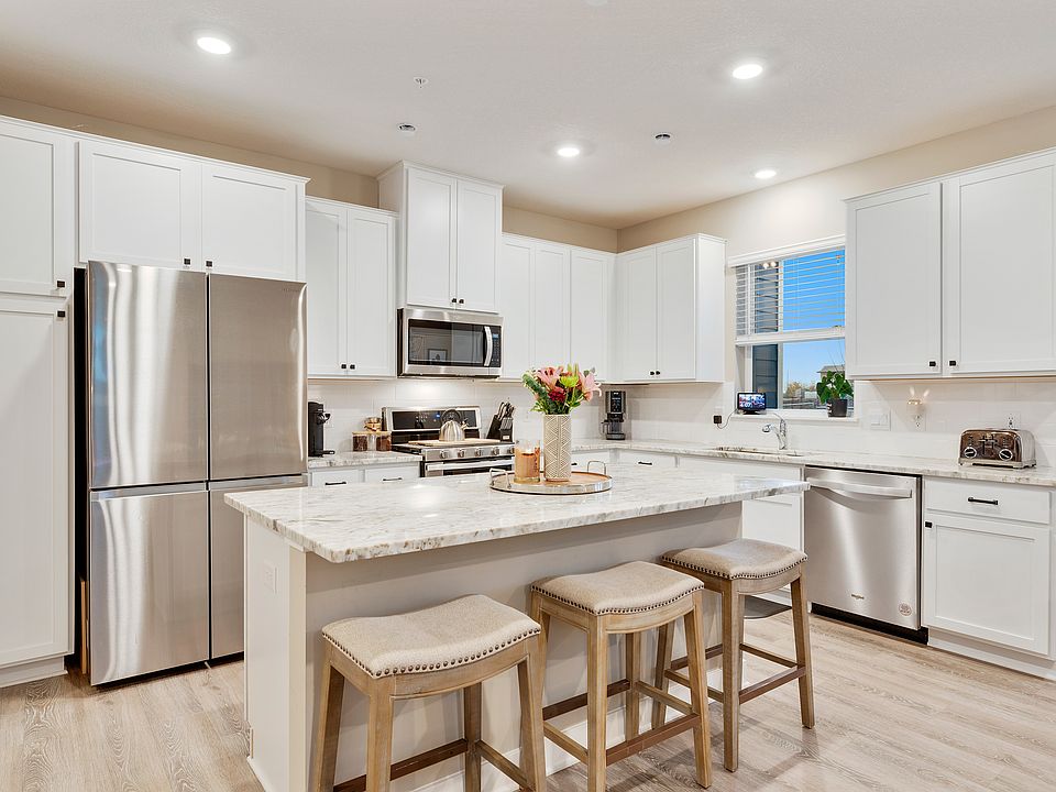 Beautiful, light, bright kitchen with tons of cabinets and countertop space.