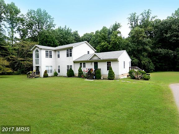 Gently Rolling Lawn / Side Driveway Parking