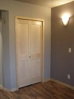 Bedroom closet. Maple doors and maple trim.